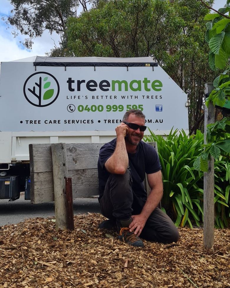 Mick from Treemate taking a call in front of the Treemate truck